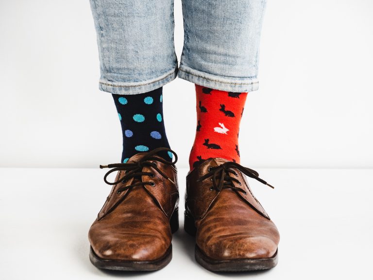 a person's feet with two different socks